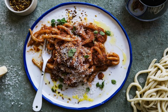 Serve this sugo-laden pasta with a heft of fantabulous  cheese.