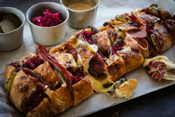 Share-friendly reuben sandwich drizzled with Russian mayo.