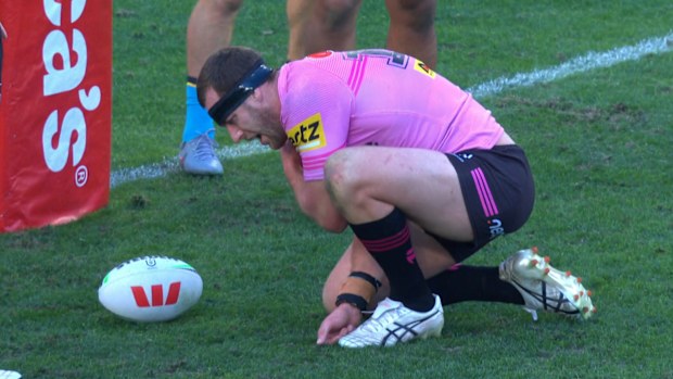Isaah Yeo grabs his shoulder in pain.