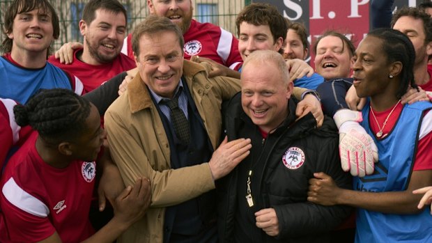 Ardal O’Hanlon as St Peter’s Celtic manager Jim O’Dea (brown coat) with Darragh Humphreys, who plays assistant manager Fran Costello (black jacket), in Fran the Man.