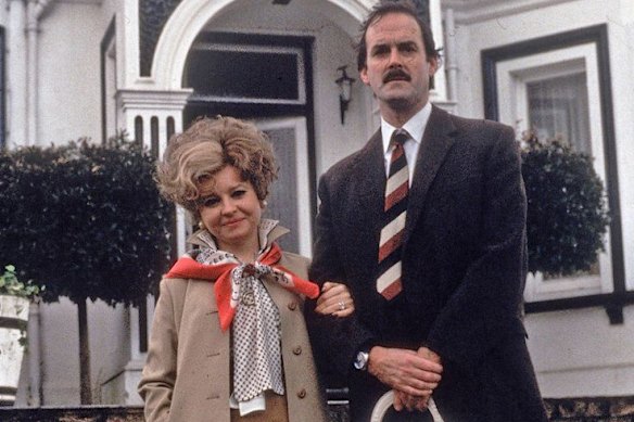 Prunella Scales and John Cleese as Sybil and Basil Fawlty in the classic British comedy Fawlty Towers.  