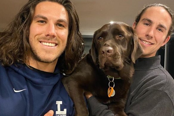 Jake and Callum Robinson with their dog.