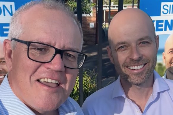 Former Prime Minister Scott Morrison with Liberal candidate Simon Kennedy at a polling booth on Saturday.
