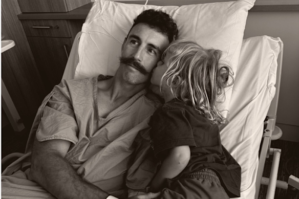 Nic White with his son Vin in hospital.
