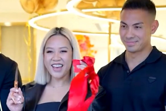 Thi Ngo Hao Vu (left) and Ibnu Pratama cut the ribbon at Beauty Pavilion’s grand opening party.