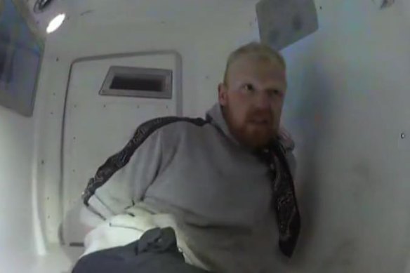 Reagan Chown captured on police body-worn camera during his arrest.