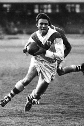  Reg Gasnier finds himself in another gap for the Dragons.