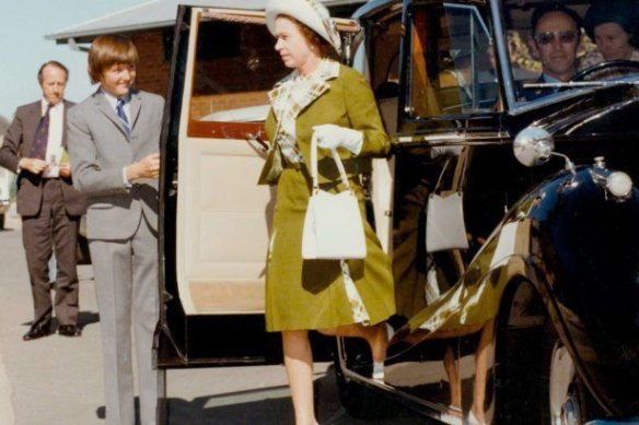 David Hayes, then 13, holds the door for the Queen.