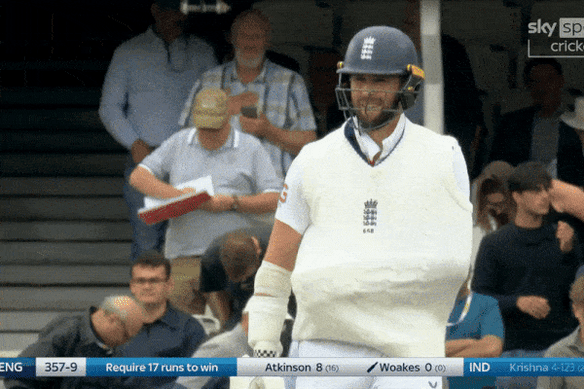 Chris Woakes walks out to bat.