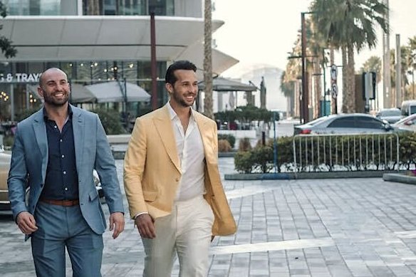 Stirling Cooper, pictured here with Tristan Tate (right), has repeatedly defended the Tate brothers after their arrest on sex trafficking charges.