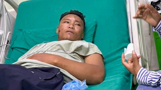 Sidar Tamang in his hospital bed on Friday. Hospital administration forbids news photography in the ward so this photo was supplied by his family.