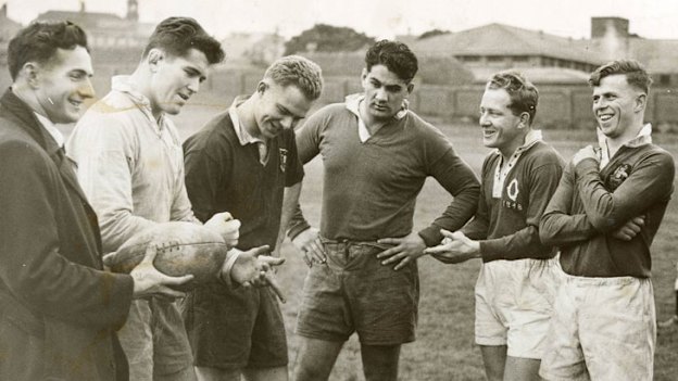 Wallabies Rex Mossop, second from left , and Dave Brockhoff, third from left, and Nick Shehadie, middle, at training at the SCG in 1950. A year earlier they won at Eden Park.