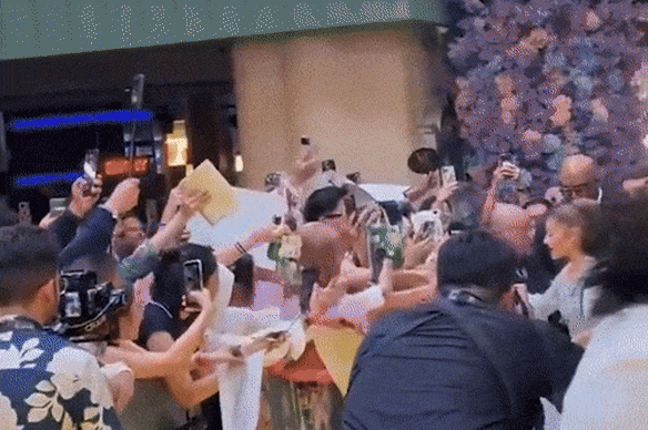 Cynthia Erivo leaps into action as public nuisance Johnson Wen grabs Ariana Grande.