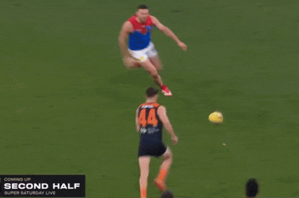 Two angles of Melbourne defender Steven May’s clash with Carlton’s Francis Evans at the MCG.