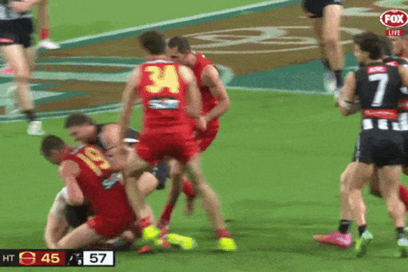The melee on the Gold Coast involving Suns and Magpies players after Ben Long’s bump on Brayden Maynard.