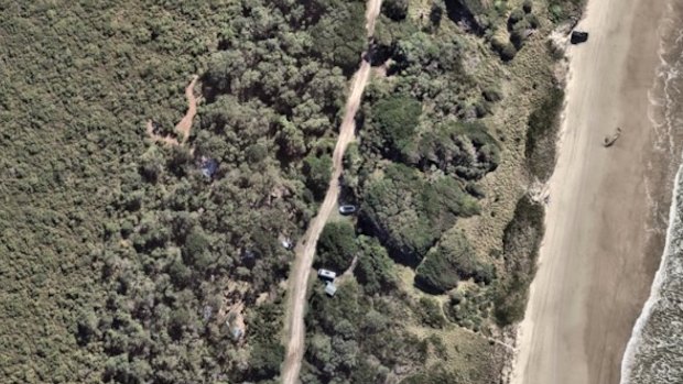 An aerial shot of the sprawling squat at Seven Mile Beach, taken in April 2025.