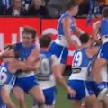 North Melbourne's Cam Zurhaar kicks a goal after the siren to beat Gold Coast.