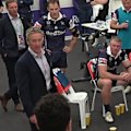 The Melbourne Storm coach stalks the room before launching into his players.