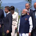 Donald Trump had to be stopped walking off in the wrong direction after a group photo at the G7.