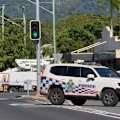 A woman from Cairns is fighting for life after being hit by a police car.