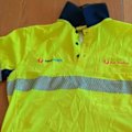 Australia Post has told its posties not to wear their new uniforms after reports workers are getting sunburnt through the polo shirts.