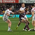Manly forward Haumole Olakau'atu scores his second try before running over and knocking out Storm centre Moses Leo.