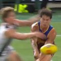 Collingwood player Steele Sidebottom had to be helped from the ground after this tackle.