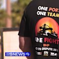 As more workers are given the green light to walk off the job, the mining giant is downplaying the impact of Pilbara's first strike in more than 25 years.