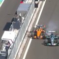 Oscar Piastri clips George Russell at the start of the Spanish Grand Prix.