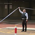A major police operation has unfolded in Perth after a woman's body was dumped on a busy street in broad daylight.