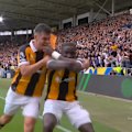 Nobel Mendy celebrates triumphantly after putting Hull 2-0 up.