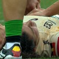 Jada Ferguson is assisted by medics after suffering a nasty headknock.