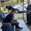 A Queensland man has been charged with bribing officials in  Bangladesh in relation to an investigation into a woman's death