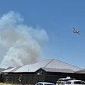 An out-of-control bushfire has come dangerously close to homes north of Adelaide.