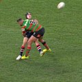 South Sydney superstar Latrell Mitchell puts a massive shot on Roosters rookie Toby Rodwell.