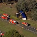 A horror crash involving a truck has put four people in hospital and closed the busy Hume Highway in both directions.