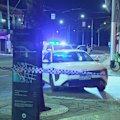 A manhunt is underway in Melbourne after a teenage boy was stabbed before being struck by a car.