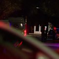 A woman has been shot dead by police after allegedly threatening them with an axe.
