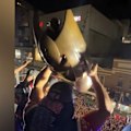 Roosters players celebrate an epic grand final victory, sharing the moment with the fans.