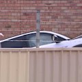 A 29-year-old woman has died in a workplace accident in Perth's north-west after becoming trapped when unloading a car from a truck.