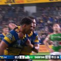 Eels centre Brian Kelly finishes off a try against the Rabbitohs.