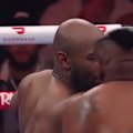 Jarrell Miller throws his hairpiece into the crowd after getting it knocked off in a boxing fight.