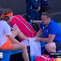 Stefanos Tsitsipas calls for medical attention on his left foot early in the first set.