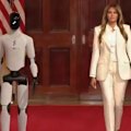 First Lady Melania Trump walks side by side with a robot for a roundtable on AI education.