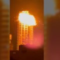 The moment a high-rise building in Bahrain is hit by a suspected Iranian drone.