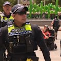 A man is in police custody after a device was thrown into a crowd during an Invasion Day rally in Perth, forcing thousands of marchers to evacuate over bomb fears.