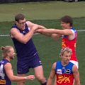 Lachie Neale misses an easy goal after Fremantle's Mason Cox bumps the Lions star and starts a scuffle.