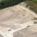 A man has been killed after a bulldozer rolled at a cement site at the Port of Brisbane.