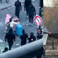 Footage of tourists wheeling suitcases through the middle of the Paris riots have gone viral