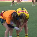 Julia Robinson pulls out of a tackle holding her arm and leaves the field.